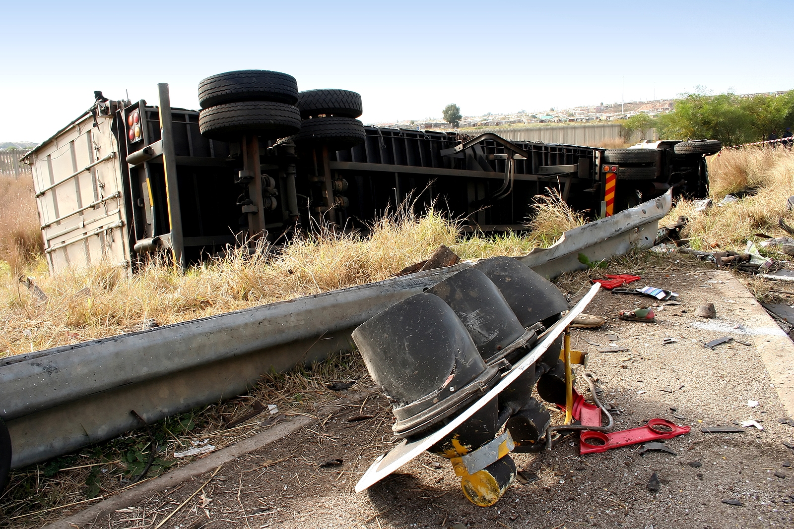 a truck lying on its side after its brakes failed